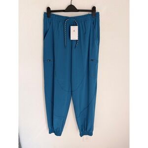 JORDAN Dri Fit Women Jogger Pants Teal Blue Cargo Pockets Zip Ankle Size L NWT